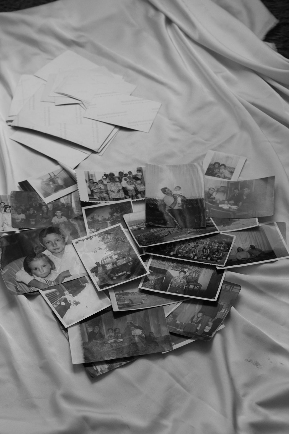 A collection of old black-and-white family photographs.