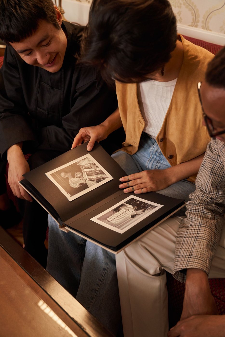 Family members look through a photo album together.
