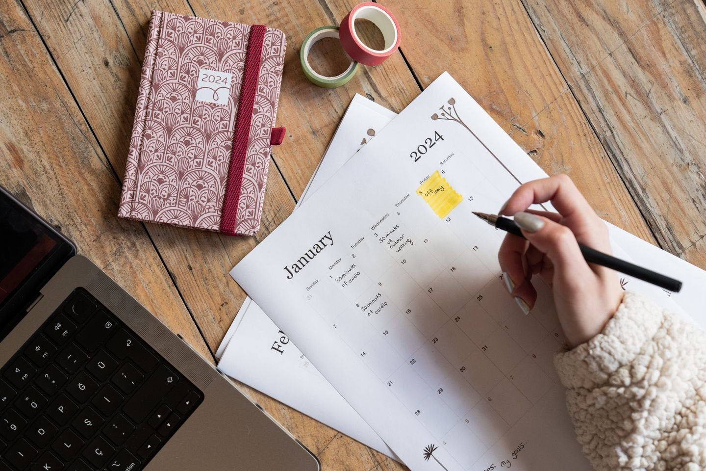 Pen marking a printed calendar